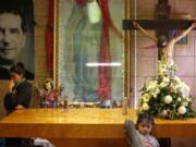 Migrants rest Feb. 26 in the chapel of the San Juan Bosco migrant shelter, in Nogales, Mexico. For years, Catholic-led, United States-based nonprofits have been at the forefront of efforts to support migrants and asylum-seekers along the Mexican border. Tough new border policies, coupled with the COVID-19 pandemic, have drastically changed their work, much of which now takes place in Mexico.