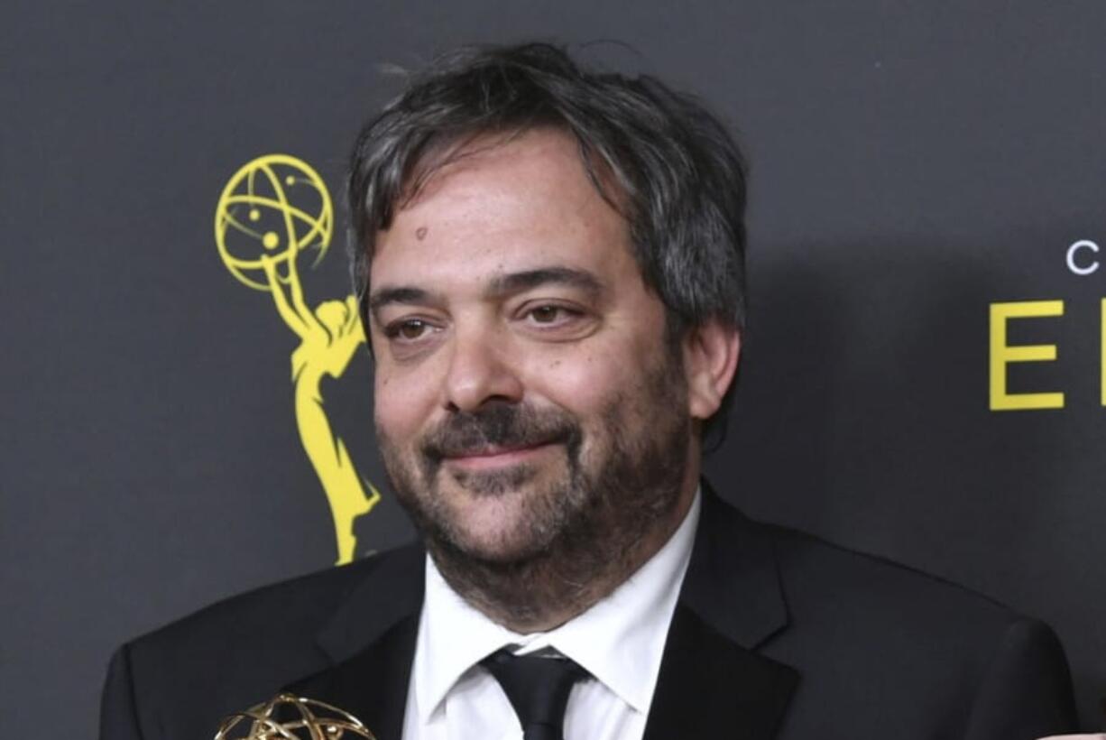 FILE - This Sept. 14, 2019 file photo shows Adam Schlesinger, winner of the awards for outstanding original music and lyrics for &quot;Crazy Ex Girlfriend,&quot; in the press room at the Creative Arts Emmy Awards in Los Angeles. Schlesinger, an Emmy and Grammy winning musician and songwriter known for his band Fountains of Wayne and his songwriting on the TV show &quot;Crazy Ex-Girlfriend,&quot; has died from coronavirus at age 51.