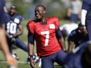 FILE - In this July 27, 2014, file photo, Seattle Seahawks quarterback Tarvaris Jackson smiles while stretching at an NFL football camp practice in Renton, Wash. Former NFL quarterback Tarvaris Jackson has died in a one-car crash outside Montgomery, Ala., authorities said Monday, April 13, 2020. He was 36. The 2012 Chevrolet Camaro that Jackson was driving went off the road, struck a tree and overturned at 8:50 p.m. Sunday, Trooper Benjamin &quot;Michael&quot; Carswell, an Alabama Law Enforcement Agency spokesman, said in a news release. Jackson was pronounced dead at a hospital.