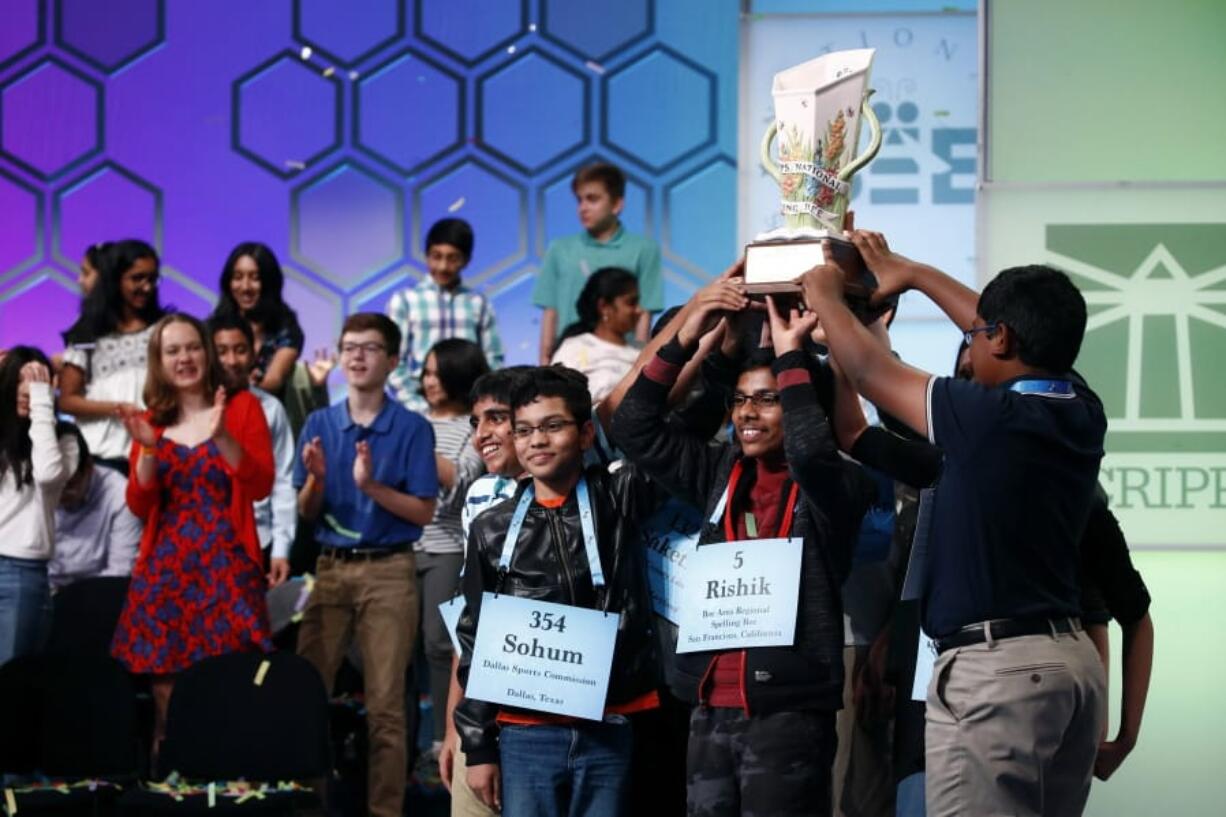 FILE - In this May 31, 2019 file photos, eight co-champions celebrate after winning the Scripps National Spelling Bee, in Oxon Hill, Md. The Scripps National Spelling Bee has been canceled after organizers concluded there was &quot;no clear path to safely set a new date in 2020&quot; because of the coronavirus pandemic.