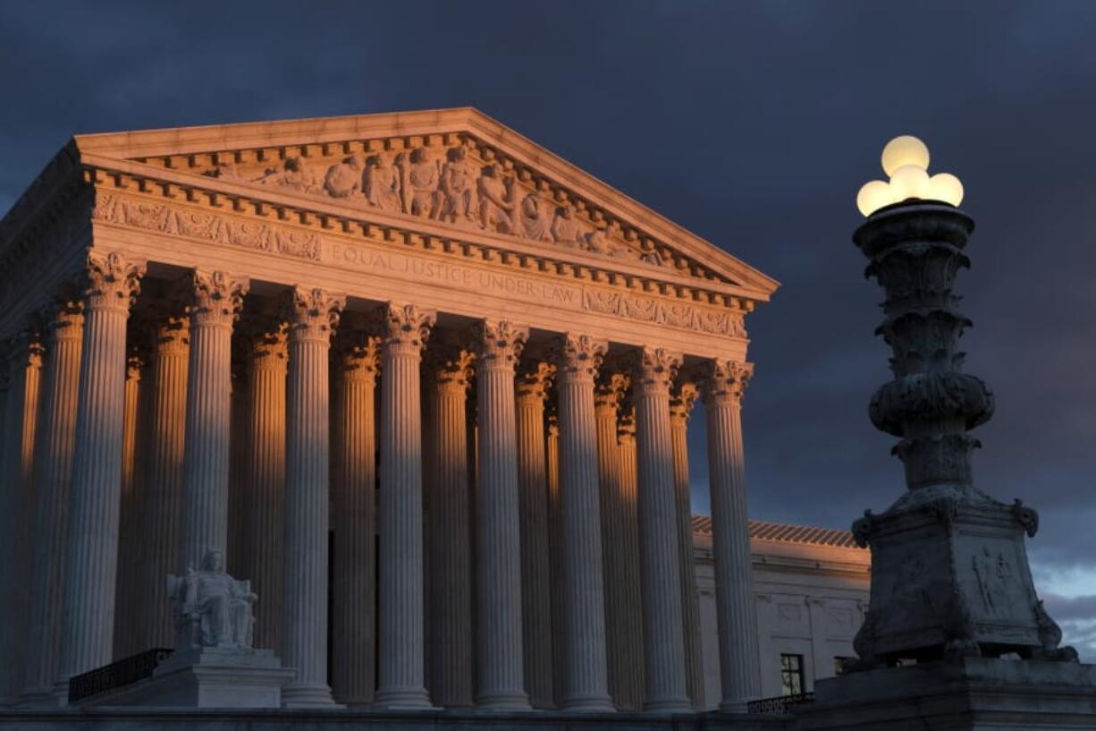 FILE - In this Jan. 24, 2019 file photo, the Supreme Court is seen at sunset in Washington. The Supreme Court has ruled that insurance companies can collect $12 billion from the federal government to cover their losses in the early years of the health care law championed by President Barack Obama. The justices voted 8-1 Monday in holding that insurers are entitled to the money under a provision of the &quot;Obamacare&quot; health law that promised the companies a financial cushion for losses they might incur by selling coverage to people in the marketplaces created by the health care law. (AP Photo/J.