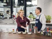 This undated image released by America&#039;s Test Kitchen shows host Bridget Lancaster, left, and Chief Creative Officer Jack Bishop from the series &quot;America&#039;s Test Kitchen.&quot; The series is marking its 20th year on PBS and mixing up a new batch of younger viewers who are drawn to the cooking show online.