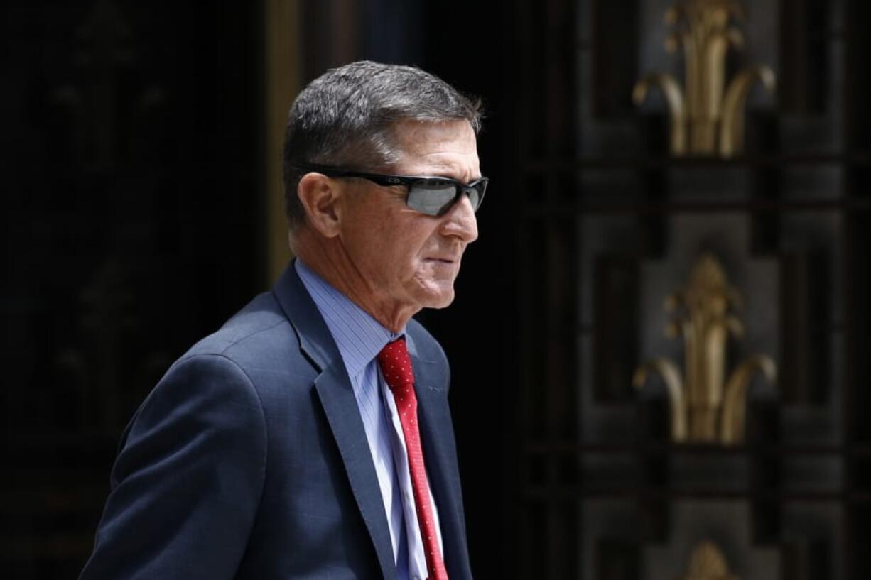 FILE - In this Monday, June 24, 2019, file photo, Michael Flynn, President Donald Trump&#039;s former national security adviser, departs a federal courthouse after a hearing, in Washington. Trump said Sunday, March 15, 2020, that he is considering a full pardon for Flynn, who had pleaded guilty to lying to the FBI about dealings with Russia&#039;s ambassador before Trump took office.