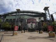 The main entrance in front of Chase Field is devoid of activity in Phoenix. Putting all 30 teams in the Phoenix area this season and playing in empty ballparks was among the ideas discussed Monday, April 6, 2020 during a call among five top officials from MLB and the players&#039; association that was led by Commissioner Rob Manfred, people familiar with the discussion told The Associated Press.  (AP Photo/Ross D.