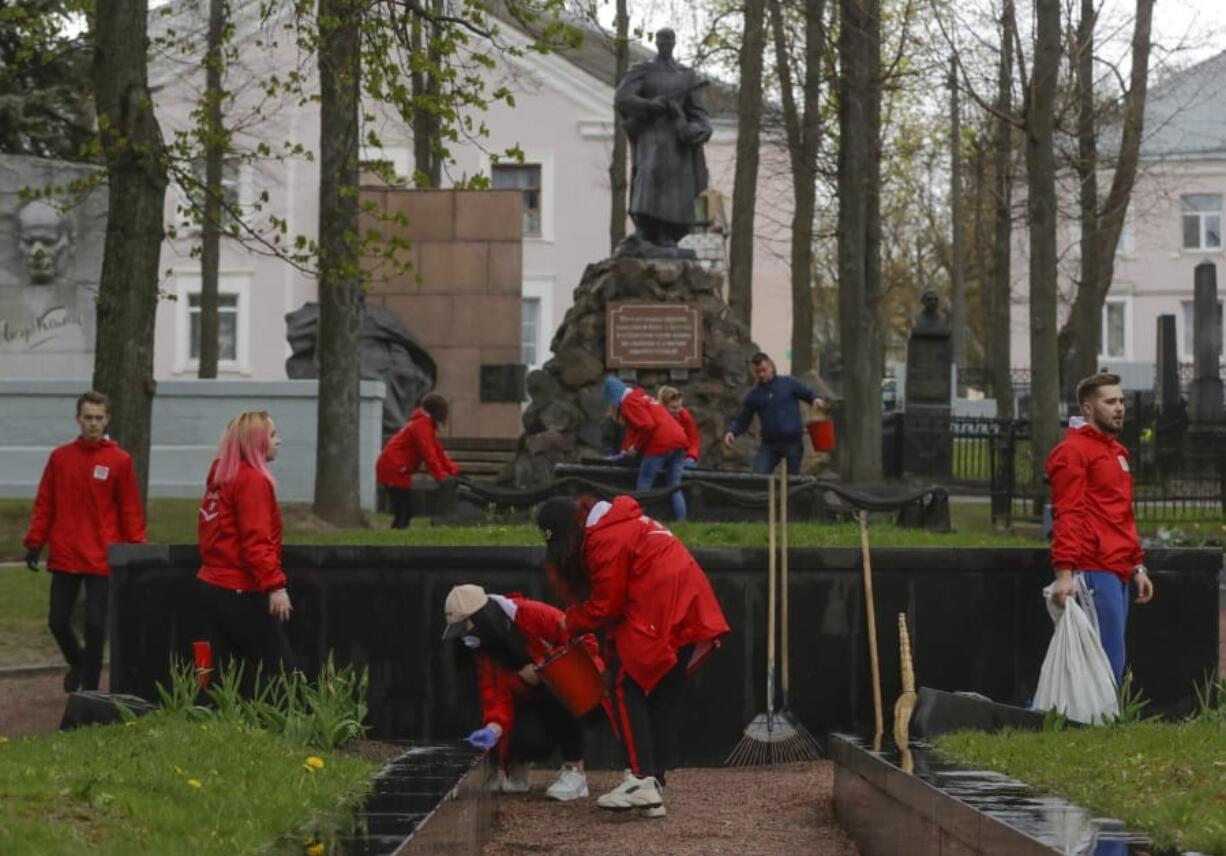 Members of the pro-government Belarussian Patriotic Union of Youth clean monuments Saturday during a subbotnik, a Soviet-style Clean-up Day, in Minsk, Belarus.