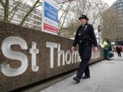 A police officer patrols outside a hospital where it is believed but not confirmed that Britain&#039;s Prime Minister Boris Johnson is undergoing tests after suffering from coronavirus symptoms, in London, Monday, April 6, 2020. British Prime Minister Boris Johnson has been admitted to a hospital with the coronavirus. Johnson&#039;s office says he is being admitted for tests because he still has symptoms 10 days after testing positive for the virus.