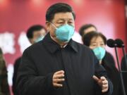 In this Tuesday, March 10, 2020, photo released by China&#039;s Xinhua News Agency, Chinese President Xi Jinping talks by video with patients and medical workers at the Huoshenshan Hospital in Wuhan in central China&#039;s Hubei Province. Top Chinese officials secretly determined they were likely facing a pandemic from a novel coronavirus in mid-January, ordering preparations even as they downplayed it in public. Internal documents obtained by the AP show that because warnings were muffled inside China, it took a confirmed case in Thailand to jolt Beijing into recognizing the possible pandemic before them.