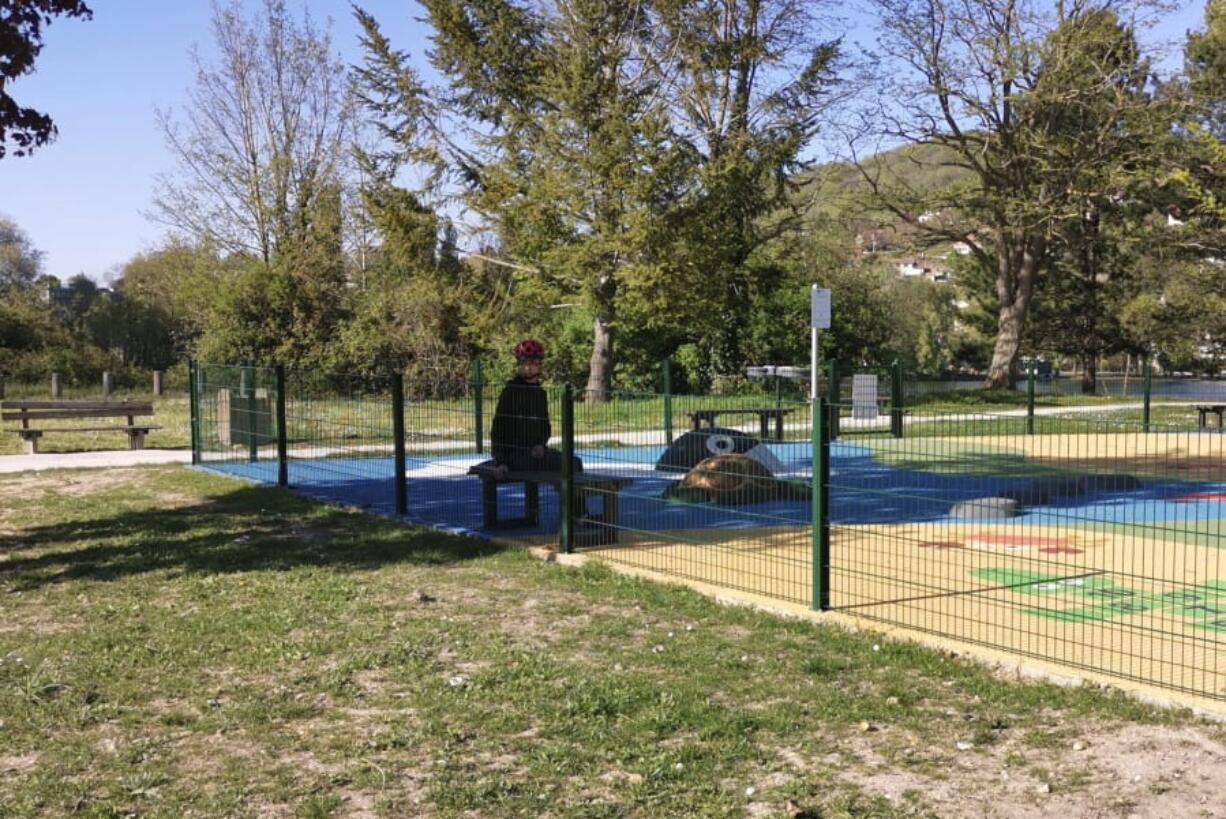 Mohammed, a 14-year-old with autism, sits at a playground outside his home April 15 in Mantes-la-Jolie, west of Paris. France&#039;s confinement measures provide an exception for people with autism that allows them to go out in places where they are accustomed to.