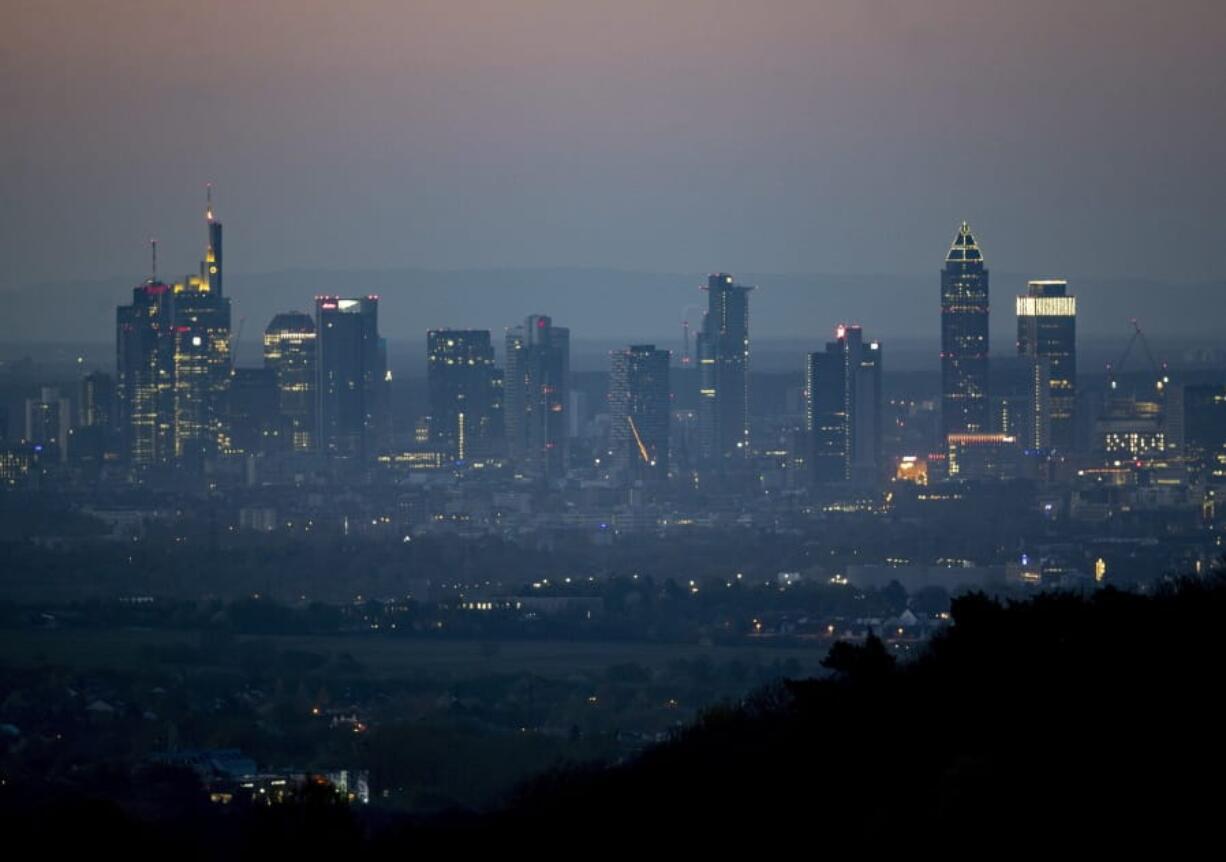 The buildings of the banking district are seen in Frankfurt, Germany, early Tuesday, April 14, 2020. Due to the coronavirus the economy expects worldwide heavy losses.