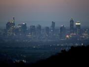 The buildings of the banking district are seen in Frankfurt, Germany, early Tuesday, April 14, 2020. Due to the coronavirus the economy expects worldwide heavy losses.