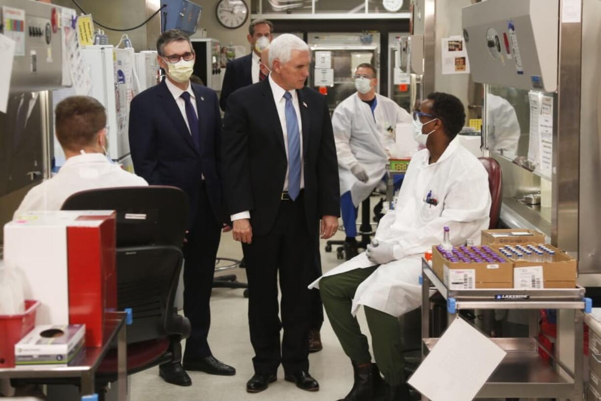 Vice President Mike Pence visits the molecular testing lab at Mayo Clinic Tuesday, April 28, 2020, in Rochester, Minn., where he toured the facilities supporting COVID-19 research and treatment. Pence chose not to wear a face mask while touring the Mayo Clinic in Minnesota. It&#039;s an apparent violation of the world-renowned medical center&#039;s policy requiring them.