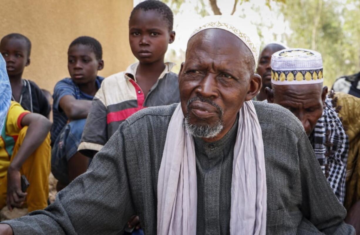 In this photo taken Sunday, March 29, 2020, Boureima Gassambe speaks to The Associated Press at the makeshift camp for the internally displaced where he and around 600 others live in an abandoned school on the outskirts of the capital, Ouagadougou, Burkina Faso. The rapid spread of the coronavirus has raised fears about the world&#039;s refugees and internally displaced people, many of whom live in war-ravaged countries that are ill-equipped to test for the virus or contain a possible outbreak. &quot;We ran away from the terrorists and came here, but now there&#039;s the coronavirus, and we don&#039;t know what will happen,&quot; said Gassambe.