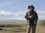 In this photo taken March 20, 2020, cattle rancher Mike Filbin stands on his property in Dufur, Ore., after herding some cows and talks about the impact the new coronavirus is having on his rural community. Tiny towns tucked into Oregon&#039;s windswept plains and cattle ranches miles from anywhere in South Dakota might not have had a single case of the new coronavirus yet, but their residents fear the spread of the disease to areas with scarce medical resources, the social isolation that comes when the only diner in town closes its doors and the economic free fall that&#039;s already hitting them hard.