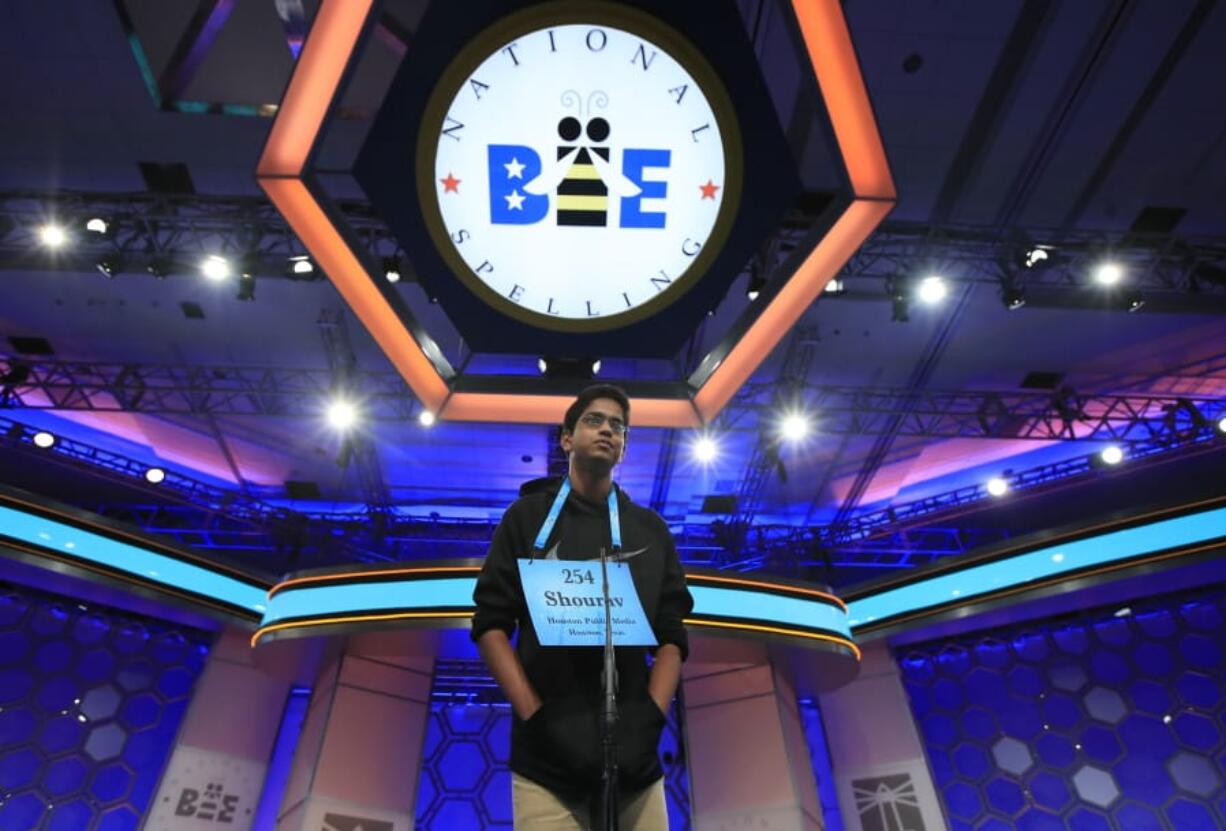 FILE - In this June 1, 2017 file photo, Shourav Dasari, 14, from Spring, Texas, correctly spells his word during the finals of the 90th Scripps National Spelling Bee, in Oxon Hill, Md.