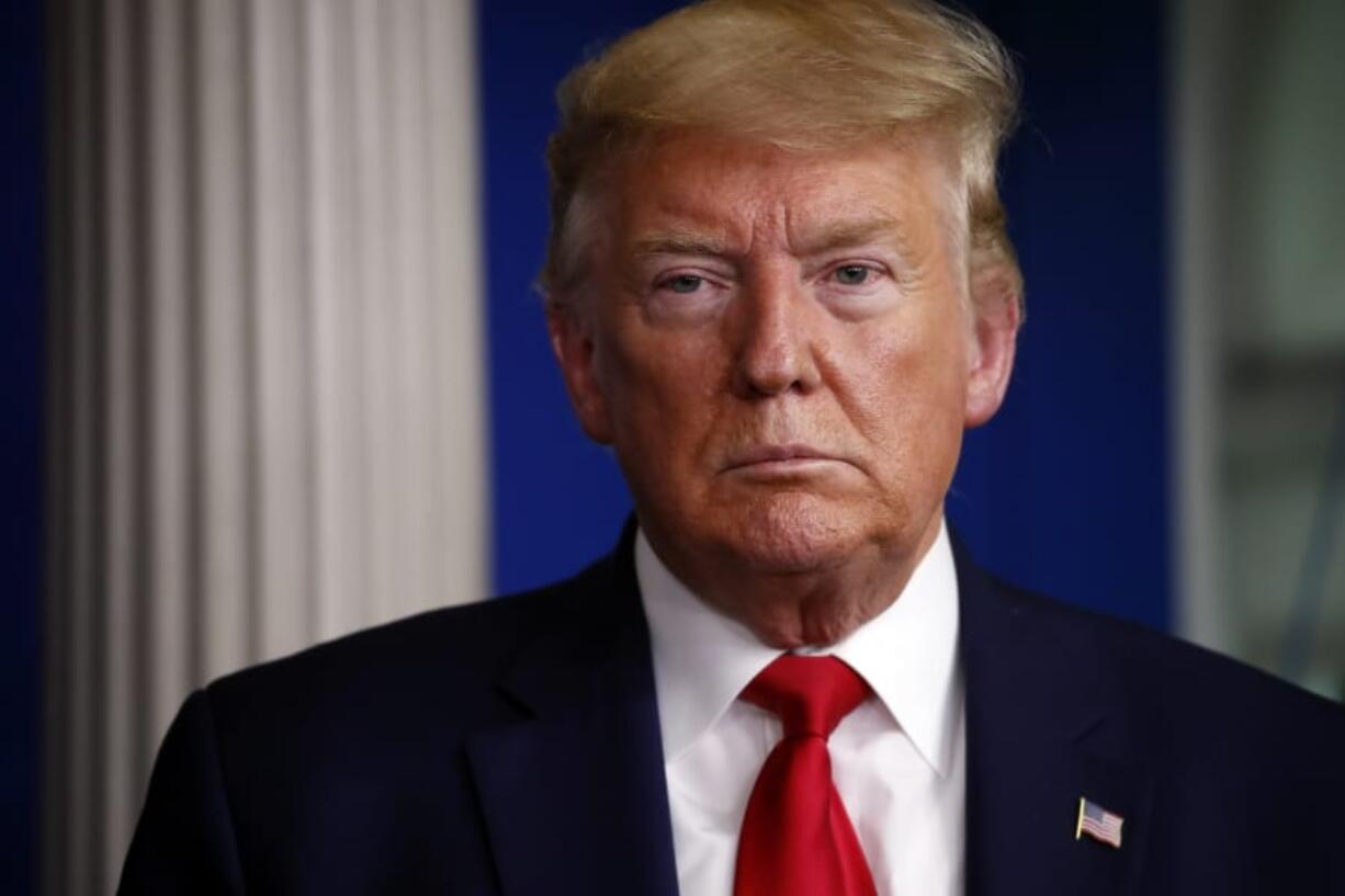 President Donald Trump listens during a briefing about the coronavirus in the James Brady Press Briefing Room of the White House, Friday, April 3, 2020, in Washington.