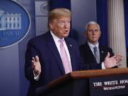 President Donald Trump speaks during a coronavirus task force briefing at the White House, Saturday, April 4, 2020, in Washington. Vice President Mike Pence listens at left. Earlier, Trump met by phone with many U.S. pro sports leaders to discuss how that industry has been affected by the global coronavirus pandemic.