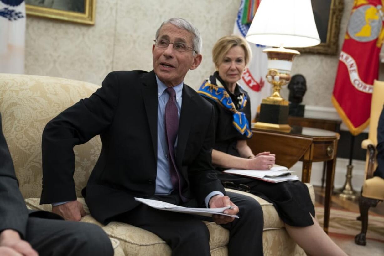 White House coronavirus response coordinator Dr. Deborah Birx listens as director of the National Institute of Allergy and Infectious Diseases Dr. Anthony Fauci speaks during a meeting between President Donald Trump and Gov. John Bel Edwards, D-La., about the coronavirus response, in the Oval Office of the White House, Wednesday, April 29, 2020, in Washington.