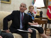 White House coronavirus response coordinator Dr. Deborah Birx listens as director of the National Institute of Allergy and Infectious Diseases Dr. Anthony Fauci speaks during a meeting between President Donald Trump and Gov. John Bel Edwards, D-La., about the coronavirus response, in the Oval Office of the White House, Wednesday, April 29, 2020, in Washington.