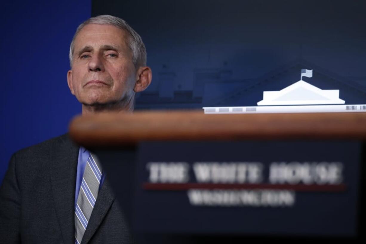 Dr. Anthony Fauci, director of the National Institute of Allergy and Infectious Diseases, listens during a briefing about the coronavirus in the James Brady Press Briefing Room of the White House, Wednesday, April 8, 2020, in Washington.