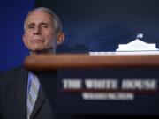 Dr. Anthony Fauci, director of the National Institute of Allergy and Infectious Diseases, listens during a briefing about the coronavirus in the James Brady Press Briefing Room of the White House, Wednesday, April 8, 2020, in Washington.