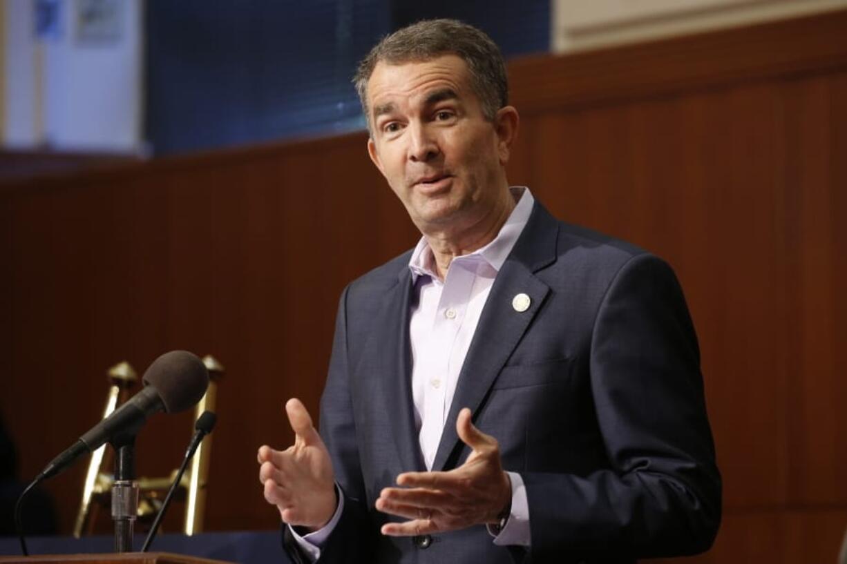 Virginia Gov. Ralph Northam gestures during a news conference at the Capitol Wednesday April 8, 2020, in Richmond, Va. Northam gave an update on his COVID-19 plans.