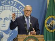 Washington Gov. Jay Inslee speaks during a news conference Monday, April 13, 2020, at the Capitol in Olympia, Wash. Inslee, along with California Gov. Gavin Newsom and Oregon Gov. Kate Brown, announced Monday that they will work together to re-open their economies while continuing to control the spread of COVID-19. (AP Photo/Ted S.