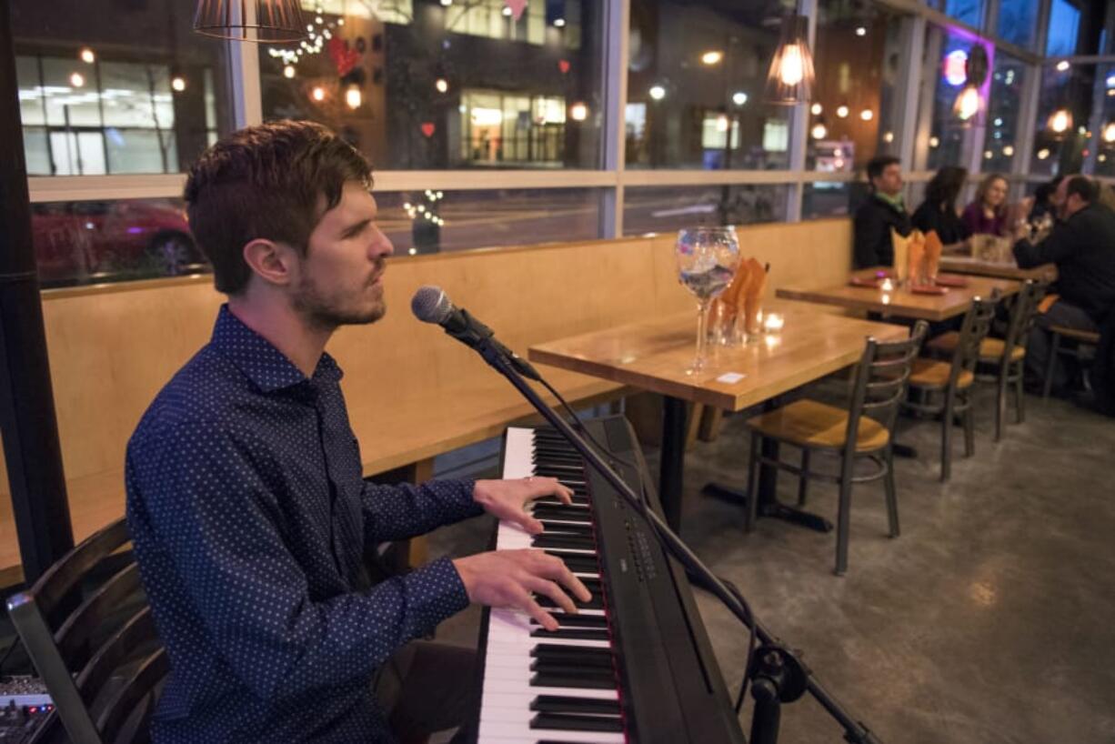 Popular local pianist and singer Mac Potts plays at Vancouver&#039;s Nom Nom restaurant in 2018. Live gigs have all dried up and Potts said he&#039;s barely hanging on offering live video performances for tips.