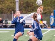 Ridgefield&#039;s Brooke Weese heads the ball over Selah defenders in the 2A third-place match last fall. The one-time Concordia commit will now play collegiate soccer at Humboldt State due to Concordia&#039;s closure in February.