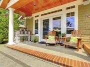 Budget-friendly upgrades such as fresh paint, area rugs and comfortable furniture can revitalize your porch.