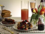 Serve the cornmeal waffles with the pineapple orange compote, or use fresh berries and blueberry syrup. Chicken breakfast sausages, a grapefruit and sparkling rose mimosa, and plenty of coffee round out the meal.