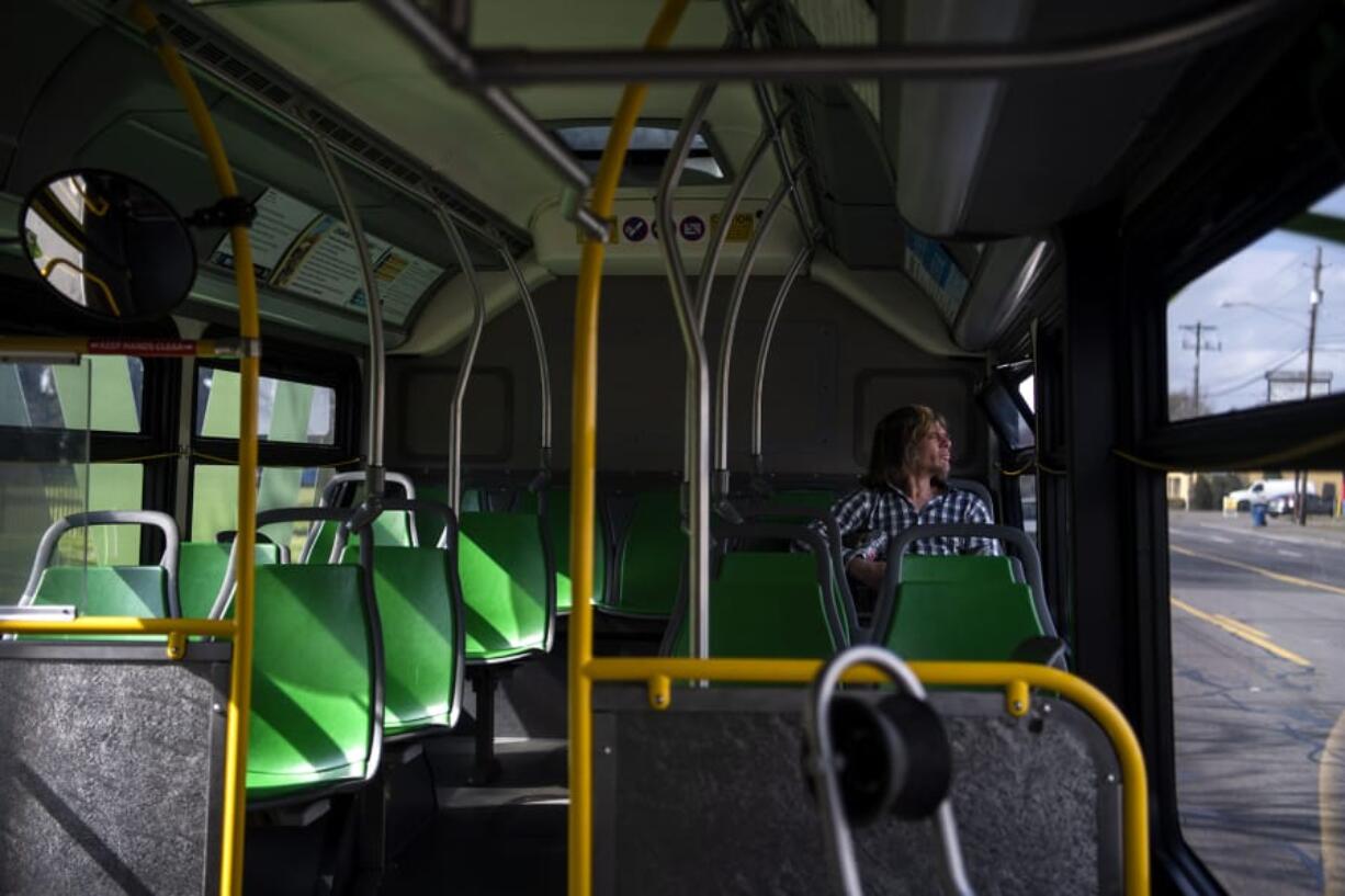 Jon Townsend of Vancouver rides The Vine on March 18. C-Tran reported that bus service is at essentially the same level as before the pandemic, but ridership is down.