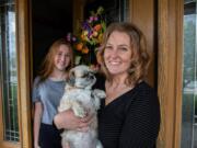 Caroline Hanna with daughter Jillian, 16, and their dog Benny at home in Mokena, Ill., on May 8. Hanna and her daughter tried to adopt an Australian shepherd puppy and sent $250 for a dog that didn&#039;t arrive.