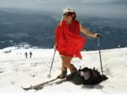 Kathy Phibbs climbed the Mount St. Helens wearing a red chiffon dress and a pillbox hat.