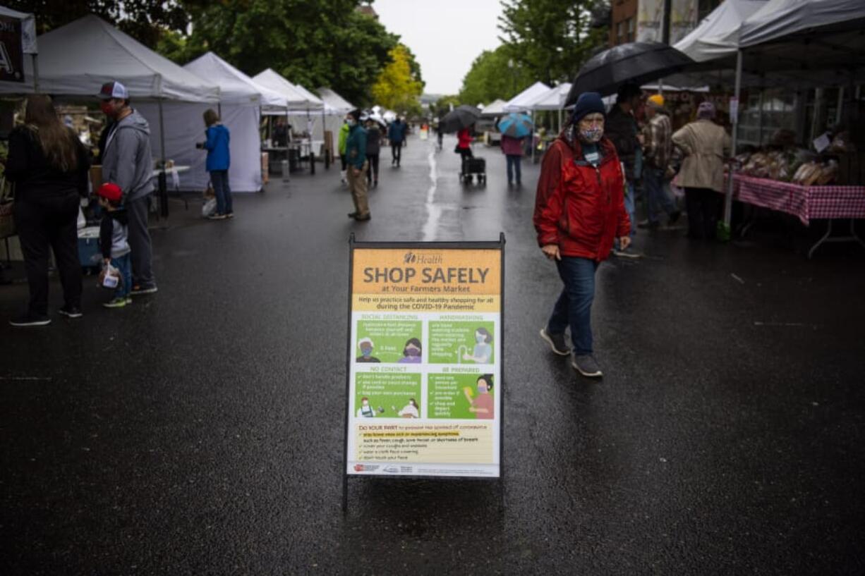 Customers make their way through the Vancouver Farmers Market on May 2. This year&#039;s markets will implement social distancing practices.