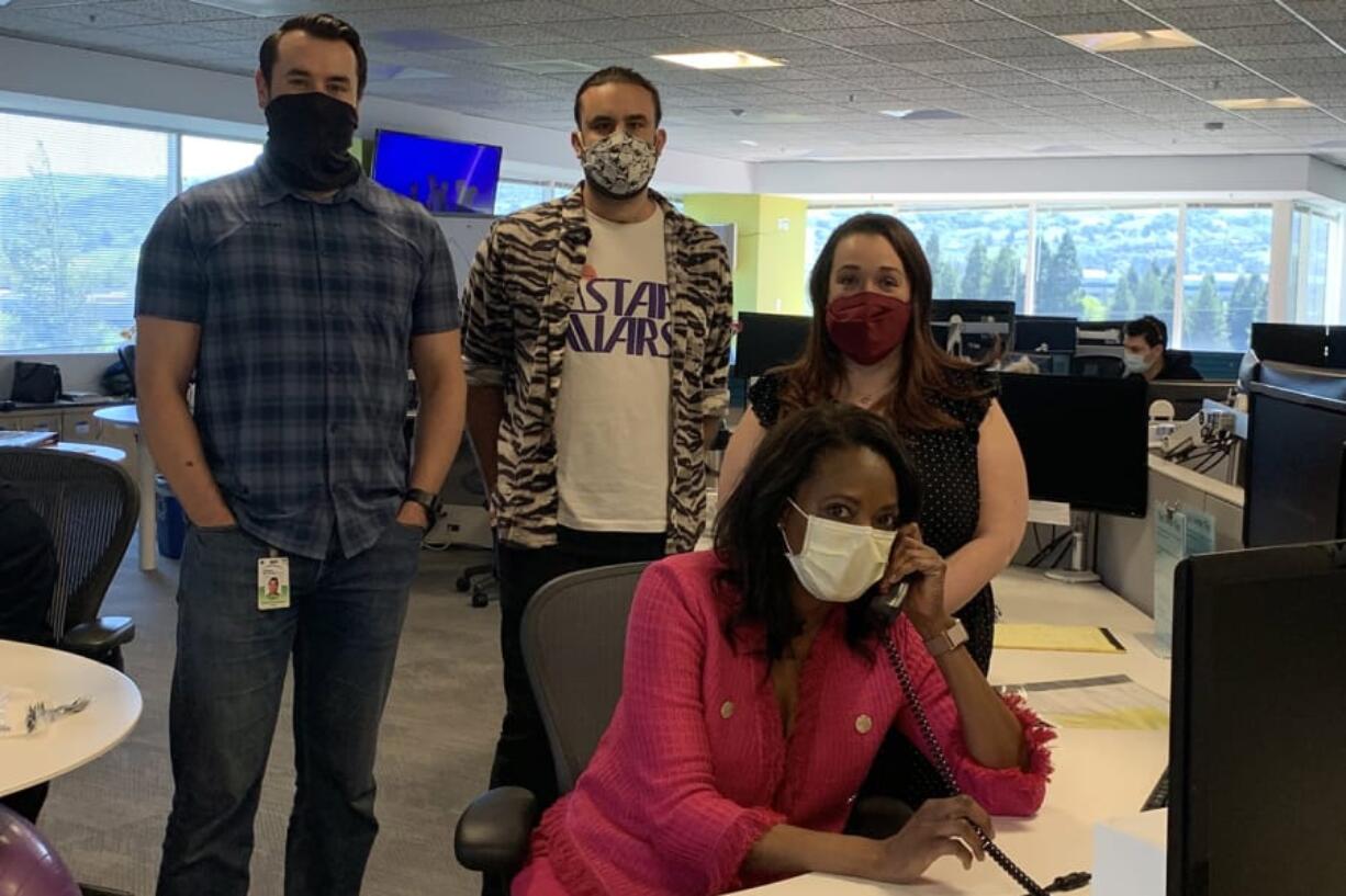 Janice Whaley (seated) is the CEO of Donor Network West, which manages organ donations from deceased donors in Northern California and Nevada. Her team takes calls from hospitals about potential organ donors.