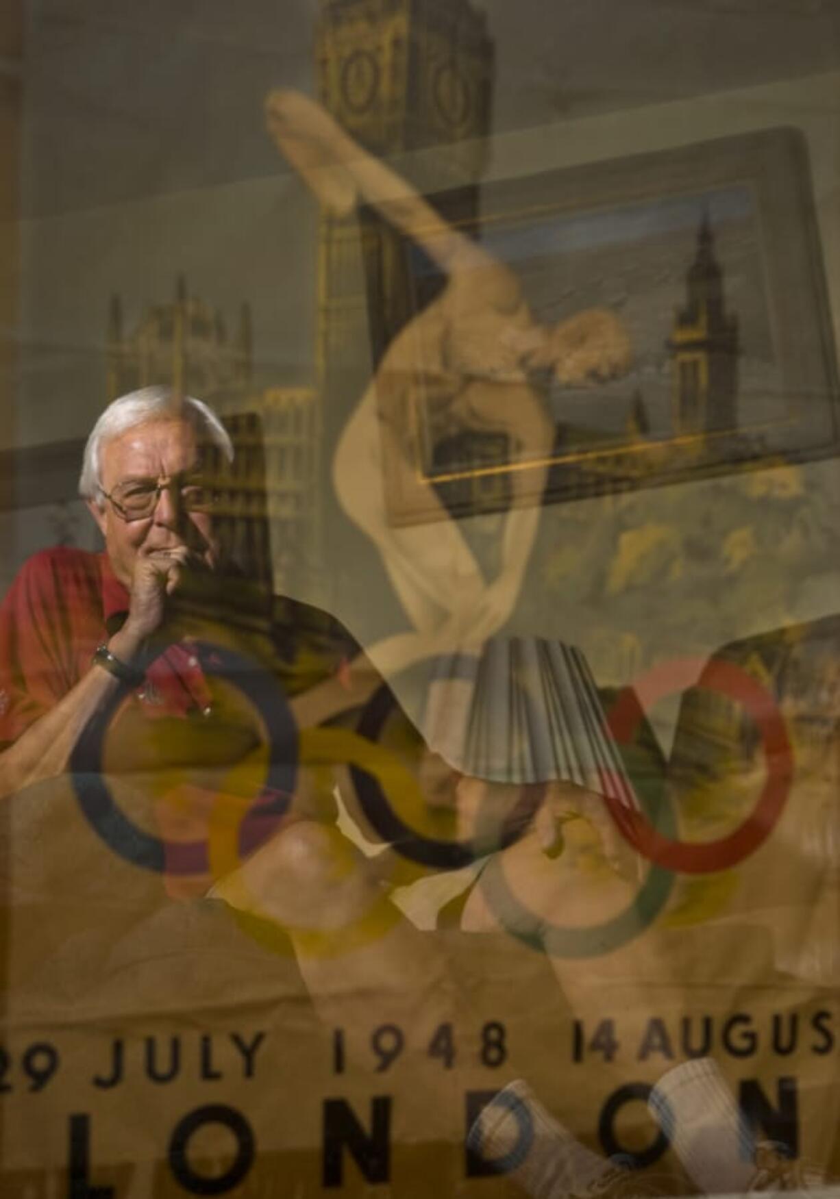 Clem Eischen represented Clark County in 1948 Olympics in London, England as a lightning fast 1500 meter sprinter. Today he lives in Gresham and Tillamook enjoying the slower pace of retirement, but still holds oon to memorabilia like this poster and an Olympic flag,  Wednesday, July 16, 2008 .