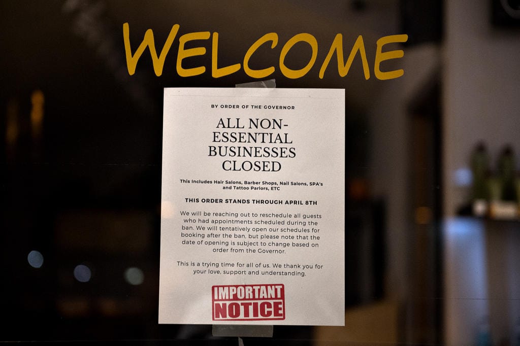 A sign on a business considered nonessential by Gov. Jay Inslee notifies customers of its closure in downtown Vancouver on March 27.