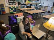 Second-grade teacher Nicole McClennen is joined by some furry friends as she records a lesson for her students on a laptop at Green Mountain School. McClennen said she tries to keep her video lessons familiar, and records them in her classroom&#039;s cozy reading corner.