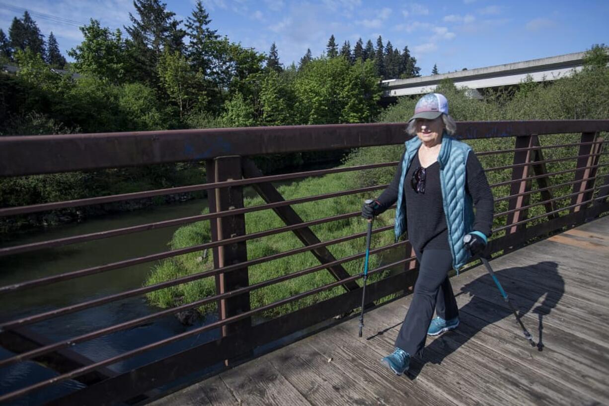 Peggy McCarthy enjoys the spring sunshine while walking the Salmon Creek Greenway Trail. Her plan to walk the Camino de Santiago pilgrim trail was blocked by COVID-19, but McCarthy sees every step she takes as part of her pilgrimage of gratitude.