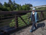 Peggy McCarthy enjoys the spring sunshine while walking the Salmon Creek Greenway Trail. Her plan to walk the Camino de Santiago pilgrim trail was blocked by COVID-19, but McCarthy sees every step she takes as part of her pilgrimage of gratitude.