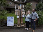 Kaaren and Daniel Spanski-Dreffin of Vancouver look over their mannequin dressed up as Optimus &quot;Amazon&quot; Prime in the front yard of their home Monday afternoon. The couple change his theme daily, to the delight of their neighbors. &quot;The whole idea is to make people laugh,&quot; Daniel Spanski-Dreffin said.