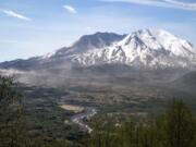 Mount St. Helens is serene on a recent morning, but its May 18, 1980, eruption was catastrophic. Subsequent eruptions ending as recently as 2008 built lava domes in the crater.