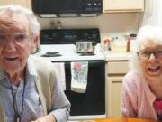 Lyle and Alice Leach, who just celebrated their 72nd anniversary, share a laugh at home.