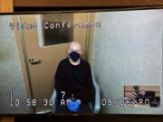 Brent Luyster III makes a first appearance via video in May in Clark County Superior Court on suspicion of attempted second-degree murder. He is accused of trying to attack a man with a knife in Vancouver's Rose Village neighborhood.