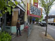 Leah Jackson, owner of Niche Wine Bar, waits for a delivery on Wednesday afternoon. Mayor Anne McEnerny-Ogle has floated the idea of turning street parking spaces into &quot;parklets&quot; where restaurants can place extra outdoor seating. Jackson said she supports that idea, which would allow her to have an additional two or three outdoor tables.