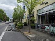 The city may allow outdoor seating in parking/loading zones, foreground center, in front of businesses such as Niche Wine Bar in downtown Vancouver.