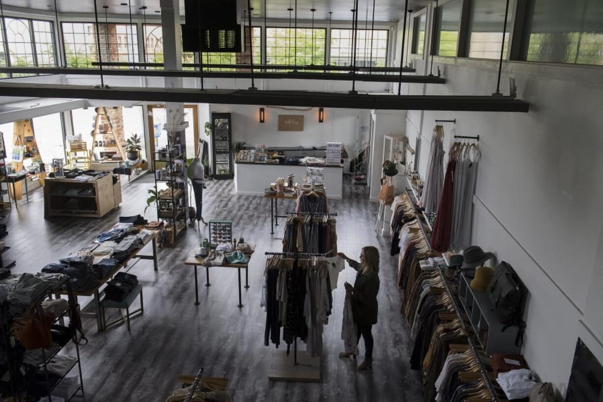 Wild Fern owner Deanna Gaines finds herself in an empty space Tuesday morning as she prepares for the reopening of her store in downtown Vancouver, which is closed during the COVID-19 pandemic.