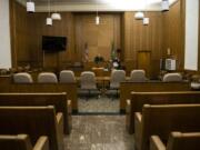 Clark County Superior Court Judge Scott Collier runs through the Adult Drug Court docket over the phone in an empty courtroom on Thursday. Many of the drug court programs are currently being conducted over the phone or over video due to the coronavirus pandemic.