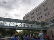 Pilots from the Oregon Air National Guard honor health care workers, first responders, and other essential staff who are working to keep local residents safe with a flyover at Legacy Salmon Creek Medical Center on Friday morning. The tribute, which traveled west to east over the facility, continued on to visit other hospitals in the region.