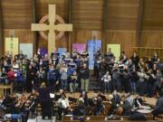 The Vancouver Master Chorale, plus full orchestra, squeezes together during a rehearsal at First Presbyterian Church in Vancouver. The physical closeness seen here is a good example of why choirs now see no choice but to wait out the end of the coronavirus pandemic.